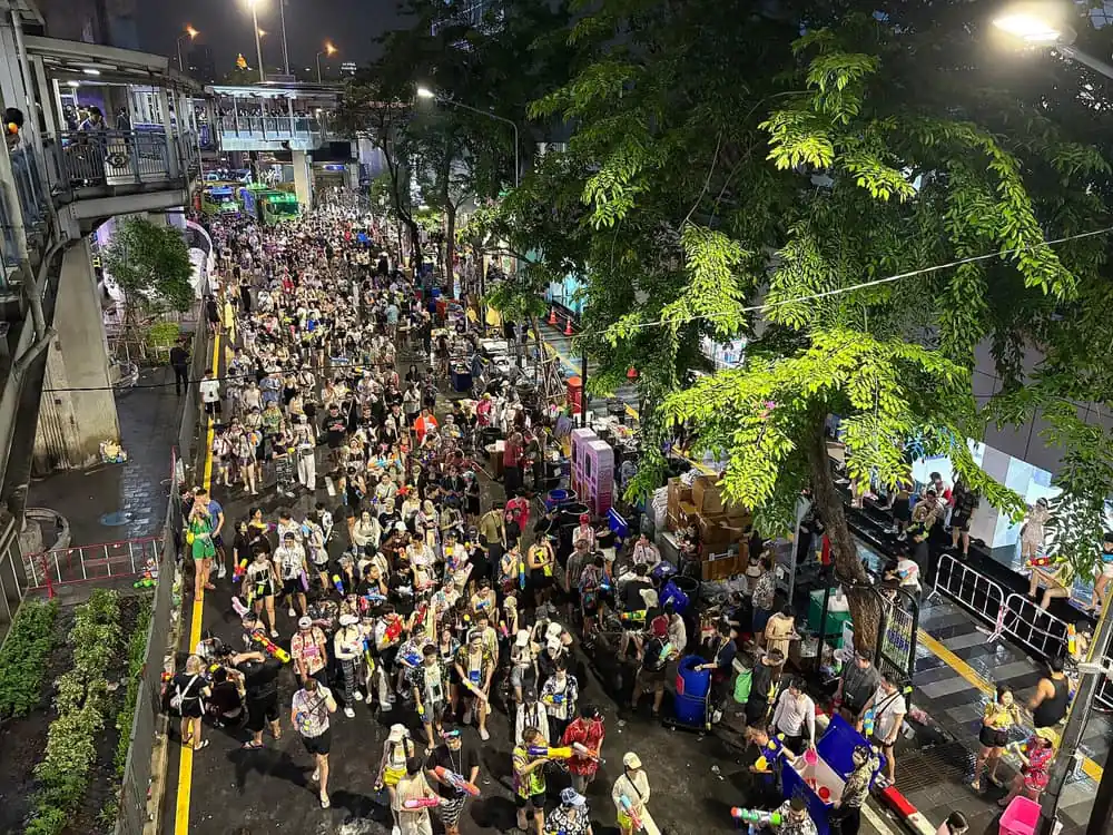 Crowds with water guns on Si Lom Road, Bangkok, during Songkran