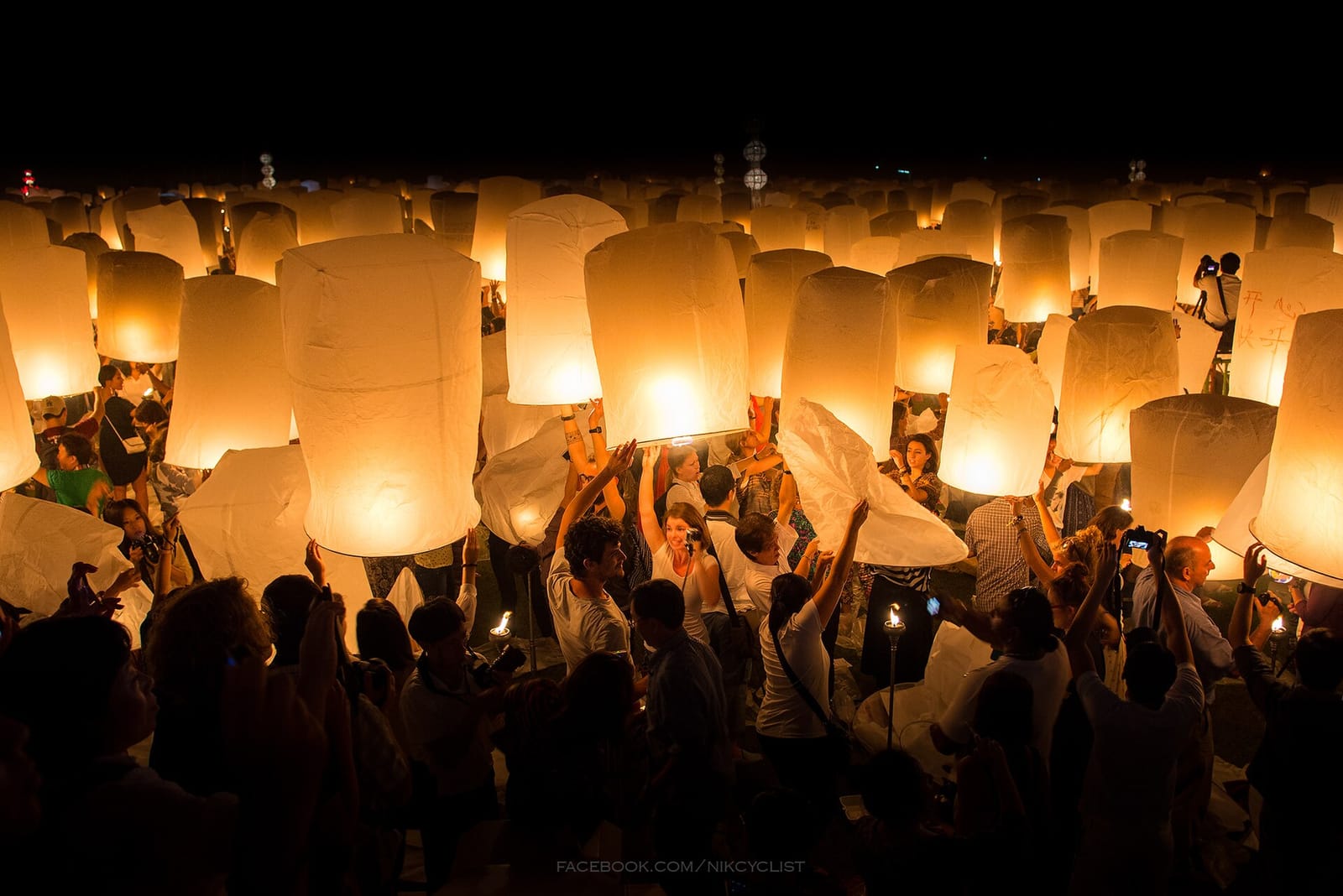 Paper lanterns rising over Chiang Mai during Yi Peng